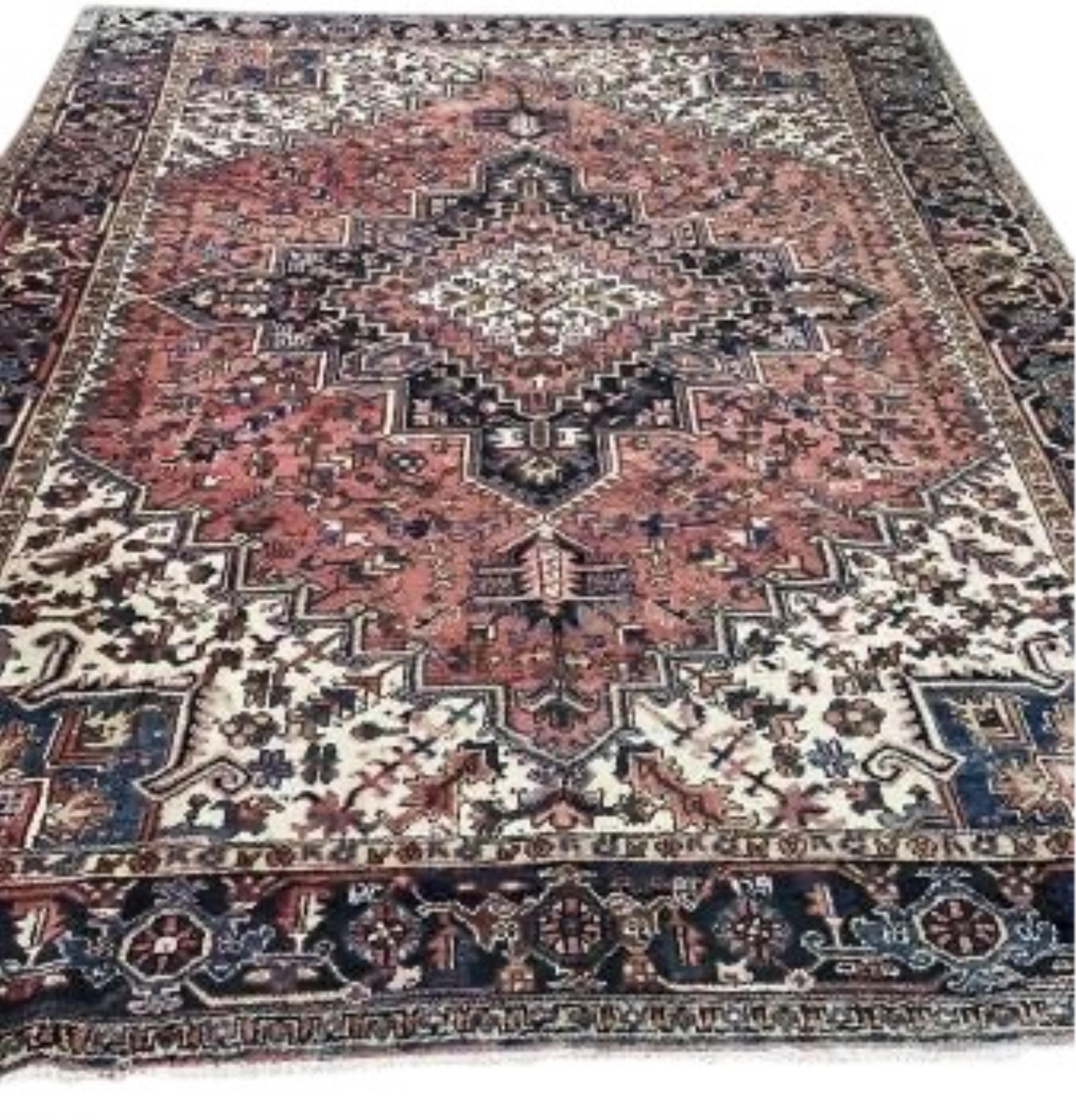 A Heriz brick red ground carpet, 330 x 270cm